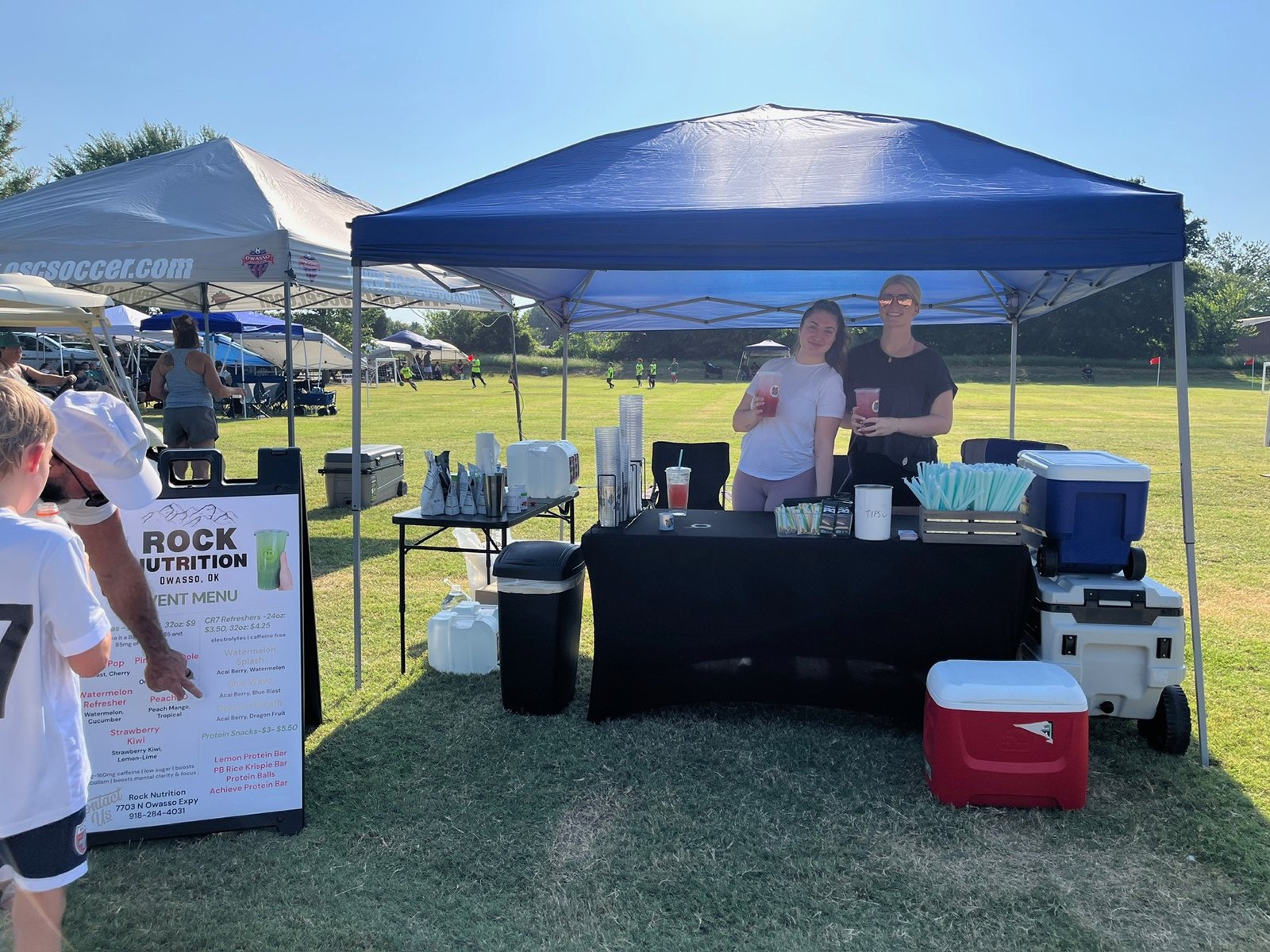 The Rock Nutrition tent serving drinks at an Owasso soccer tournament